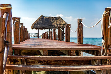 A beautiful beach dock with palapa, on the beautiful caribbean sea in the Riviera Malla, this type...