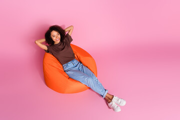 Full body photo of attractive young woman sleeping sit bean bag dressed stylish brown clothes...