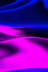 Fototapeta premium Abstract wavy background in purple and blue hues with a glossy, liquid metal appearance, wallpapers, or graphic design elements. Black blue purple silk satin. Сopy space for text or product 