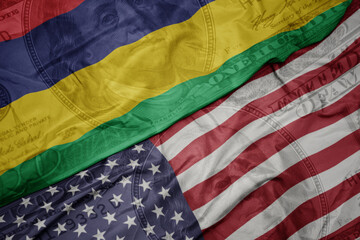 waving colorful flag of united states of america and national flag of mauritius on the dollar money background. finance concept.