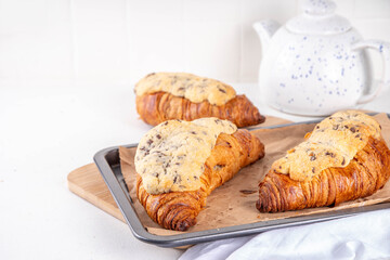 Trendy French sweet dessert pastry crookie, a hybrid of croissant with sweet butter cookies with...