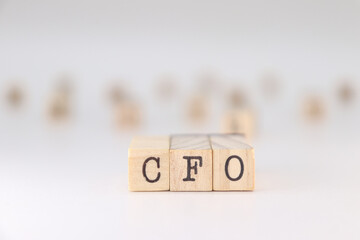CFO acronym. Concept of Chief Financial Officer written on wooden cubes isolated on white background.