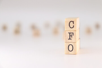 CFO acronym. Concept of Chief Financial Officer written on wooden cubes isolated on white background.