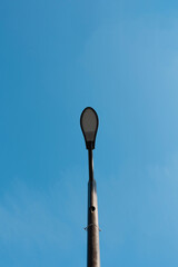 Modern led lights in city, saving of electrical energy concept . Vertical shot