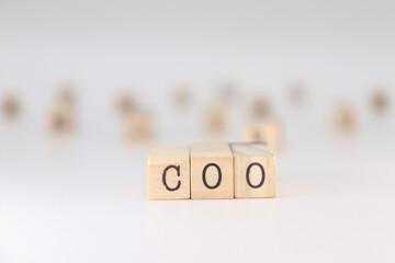 COO Acronym. Concept of Chief Operating Officer written on wooden cubes isolated on white background