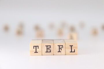 Acronym TEFL. Concept of Teaching English as a foreign language written on wooden cubes isolated on white background