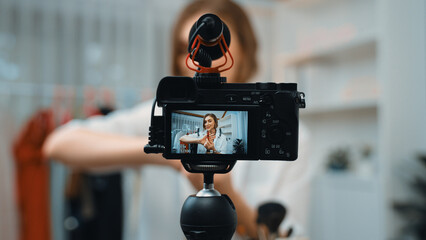 Woman influencer shoot live streaming vlog video review makeup prim social media or blog. Happy...