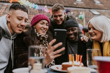 Man examining a friend group selfie