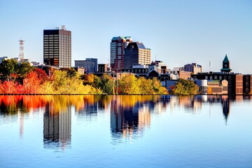 Autumn Splendor: Stunning 4K image of Manchester, New Hampshire Skyline Along the Merrimack River