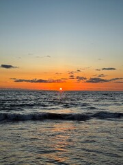 Sunset sky. Nature beautiful Light Sunset or sunrise over sea,Colorful dramatic majestic scenery sunset Sky with Amazing clouds and waves in sunset sky purple light cloud background. Bali. ocean