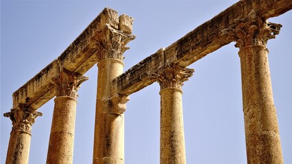 stone columns of archaeological remains against the sky