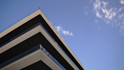corner of modern residential building against cloudy sky