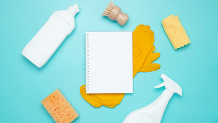 Various accessories cleaning products, sprays, rags, sponges and brushes. Mock up white notebook....