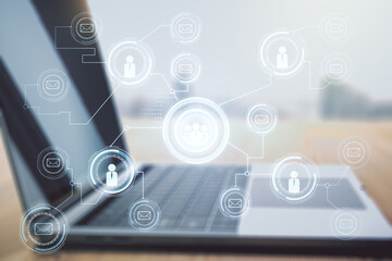 Social network concept with modern laptop on background. Multiexposure