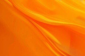 Obraz premium Bright orange fabric with a smooth flowing texture