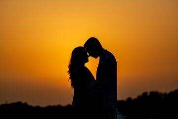 Silhouette Of Pakistani  Couple During Sunset At Sea view Karachi beach wedding shoot. No Face