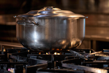 Big Cook pot on gas stove. preparing food in kitchen.