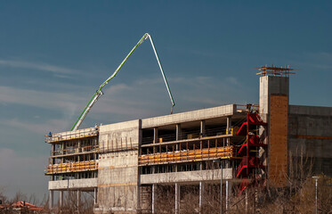 Concrete boom arm on the roof of a building under construction © F Armstrong Photo