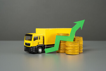 Truck and green arrow up. Growth in freight traffic, revenues and fees. Economic development. Increased prices.