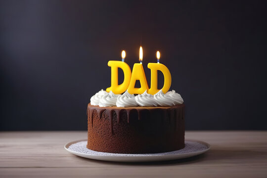Chocolate cake for father's day with candles against dark background. Cake with dad word. Happy father's day concept. men's cake