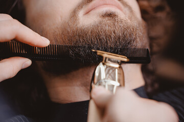 Macro photo Man hipster having barber shave barbershop hair machine.