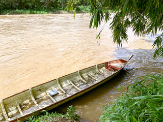 a river with wooden boat