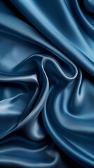 Obraz premium Blue satin fabric in folds. Studio shot of a textile texture. Design for textile, fashion, and interior.