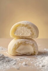 Halved Mochi with Cream Filling on Neutral Backdrop under Studio Lights