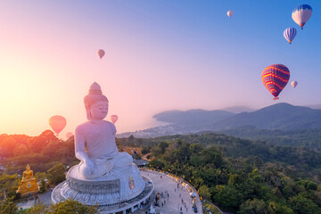 Aerial view Big Buddha statue with balloons on Phuket Thailand sunset light by drone