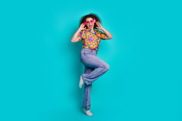 Photo of crazy positive nice girl wear stylish print clothes have fun weekend isolated on cyan...