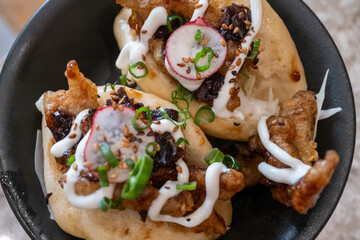 Bao buns with chicken and mushrooms close-up