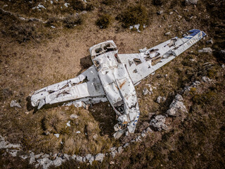 Plane crashed in a mountain, vegetation with ancient Roman ruins, spring colour, aerial photography, drone photo
