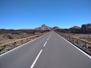 Driving along the road along Teide POV shot from a camera driving through beautiful empty road. ...