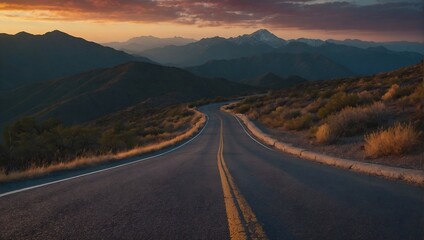 A road passes through the mountains at sunset - obrazy, fototapety, plakaty