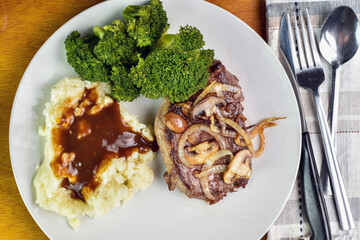 boneless steak  with mash potatoes and broccoli