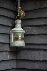 Old marine lantern in a corner.