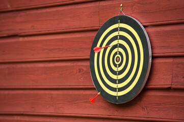 Two red arrows on a dart board.