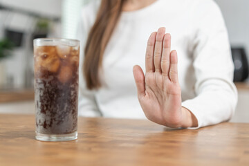 Diet, Dieting close up asian young woman, girl hand gesture push out, deny or refuse cola drink,...
