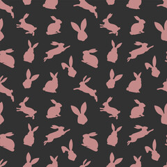 Easter seamless pattern of red rabbit silhouettes in different actions. Festive Easter bunnies design. Isolated on black background. For Easter decoration, wrapping paper, greeting, textile, print