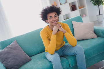 Photo of nice young man sit couch smile wear yellow pullover white interior apartment indoors
