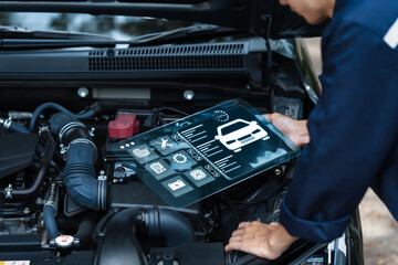Car mechanic checking customer service concept With laptop tools about car diagnostics in technology To check the system for quality