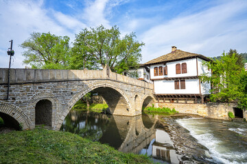 Fototapeta premium The old bridge and traditional Bulgarian houses in the old town of Tryavna, Bulgaria