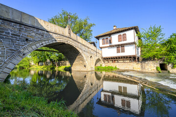 The old bridge and traditional Bulgarian houses in the old town of Tryavna, Bulgaria