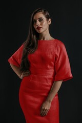 Fototapeta premium Woman wearing red dress, studio shoot