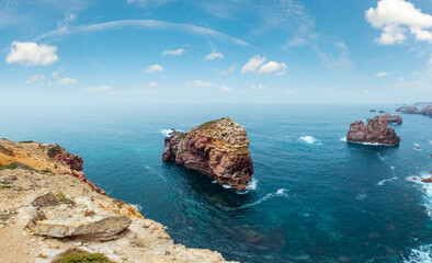 Rock formations near shore. Summer Atlantic rocky coast view (Costa Vicentina, Algarve, Portugal).