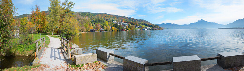 walkway at lakeside Mondsee, tourist destination Salzkammergut, austrian landscape