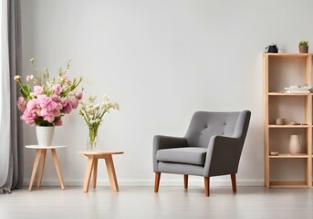 Aesthetic room interior with comfortable gray armchair, shelving unit, and spring flowers near the wall