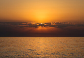 Sunrise over the Mediterranean Sea seen from the beach in Torremolinos. Costa del Sol, Spain