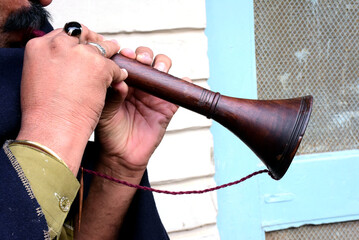 a man playing the musical bugle.