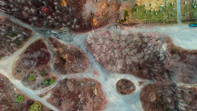 Aerial top down of cemetery and forest in Fall around abandoned coal town Centralia Pennsylvania